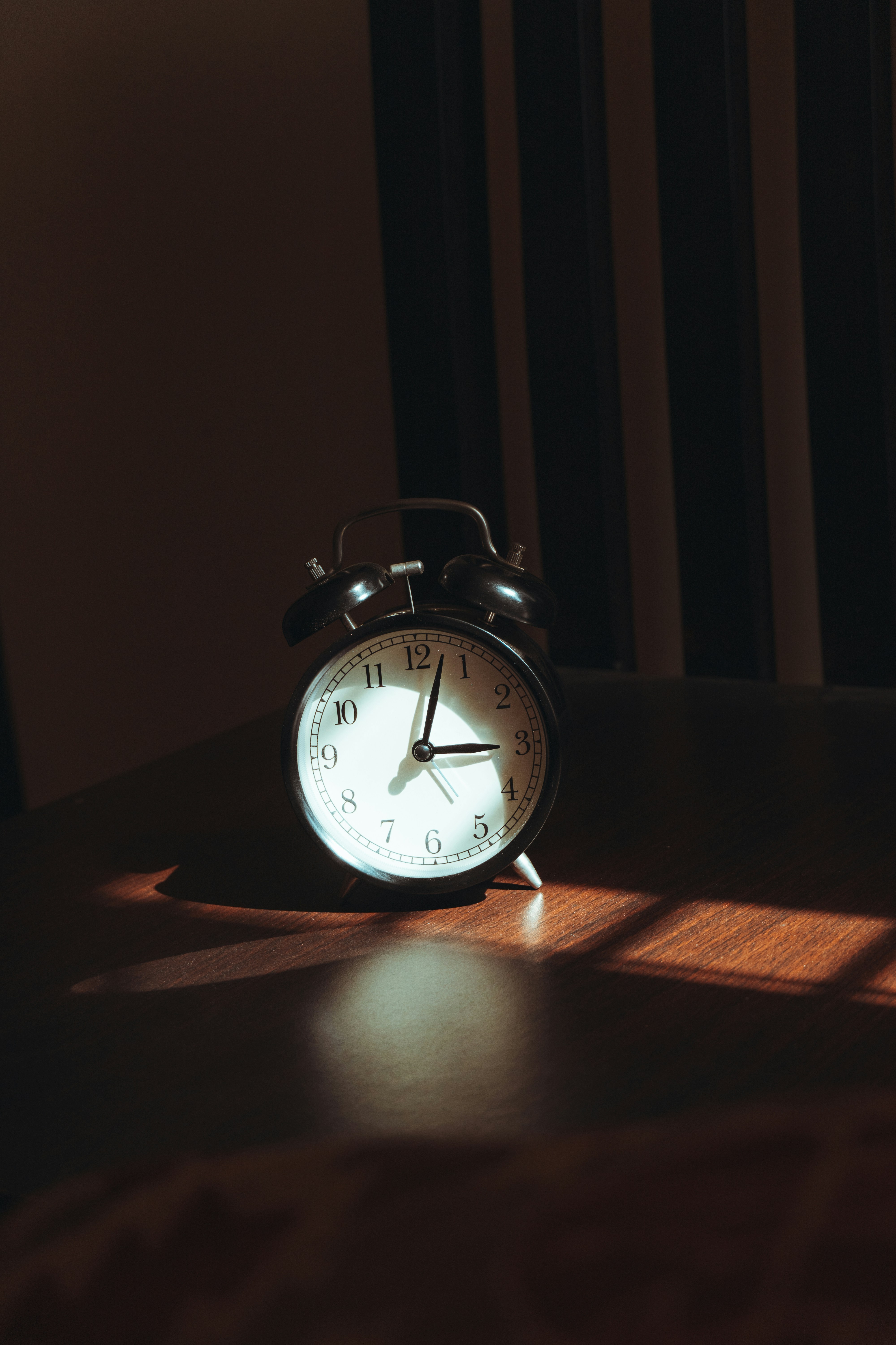 Person lying awake in bed in the middle of the night, experiencing sleep maintenance insomnia